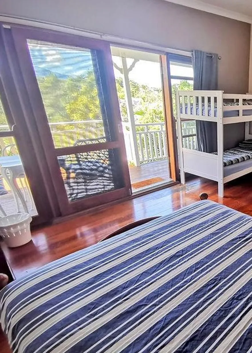 Room 9, the family room with bunks and a private balcony